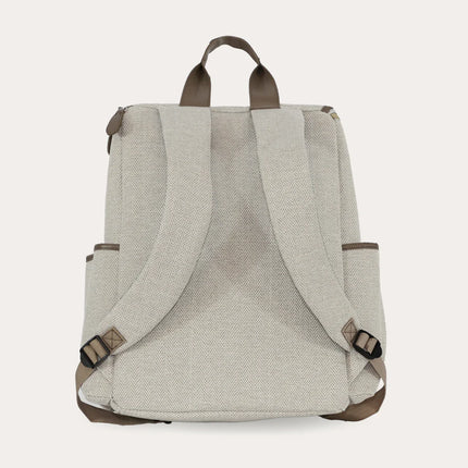 Rear view of the Oatmeal changing backpack's adjustable straps and side pockets.