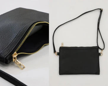 Black cross body bag that is included with the changing bag with gold zipper and cross body strap.