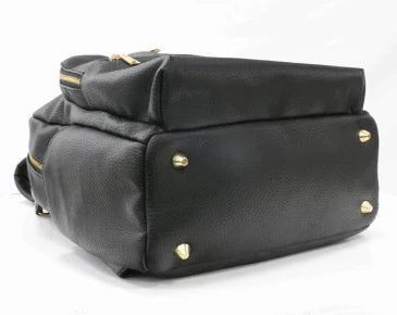 Black changing backpack with gold feet.