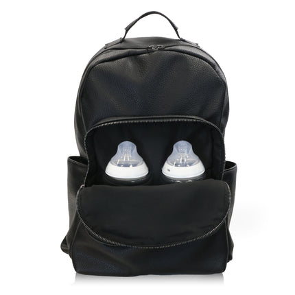 Black backpack with two baby bottles inside on a white background