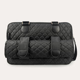 Image showing the back of the shoulder bag with 2 loophols for the changing mat to be stored.