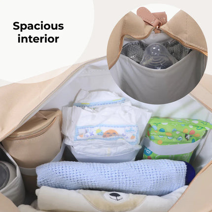 Image showing the inside of the blush changing bag from my babiie filled with a range of baby products.