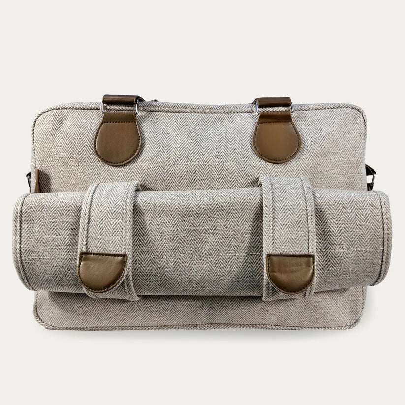 Image showing the back of the bag where 2 loop clips hold the changing mat.