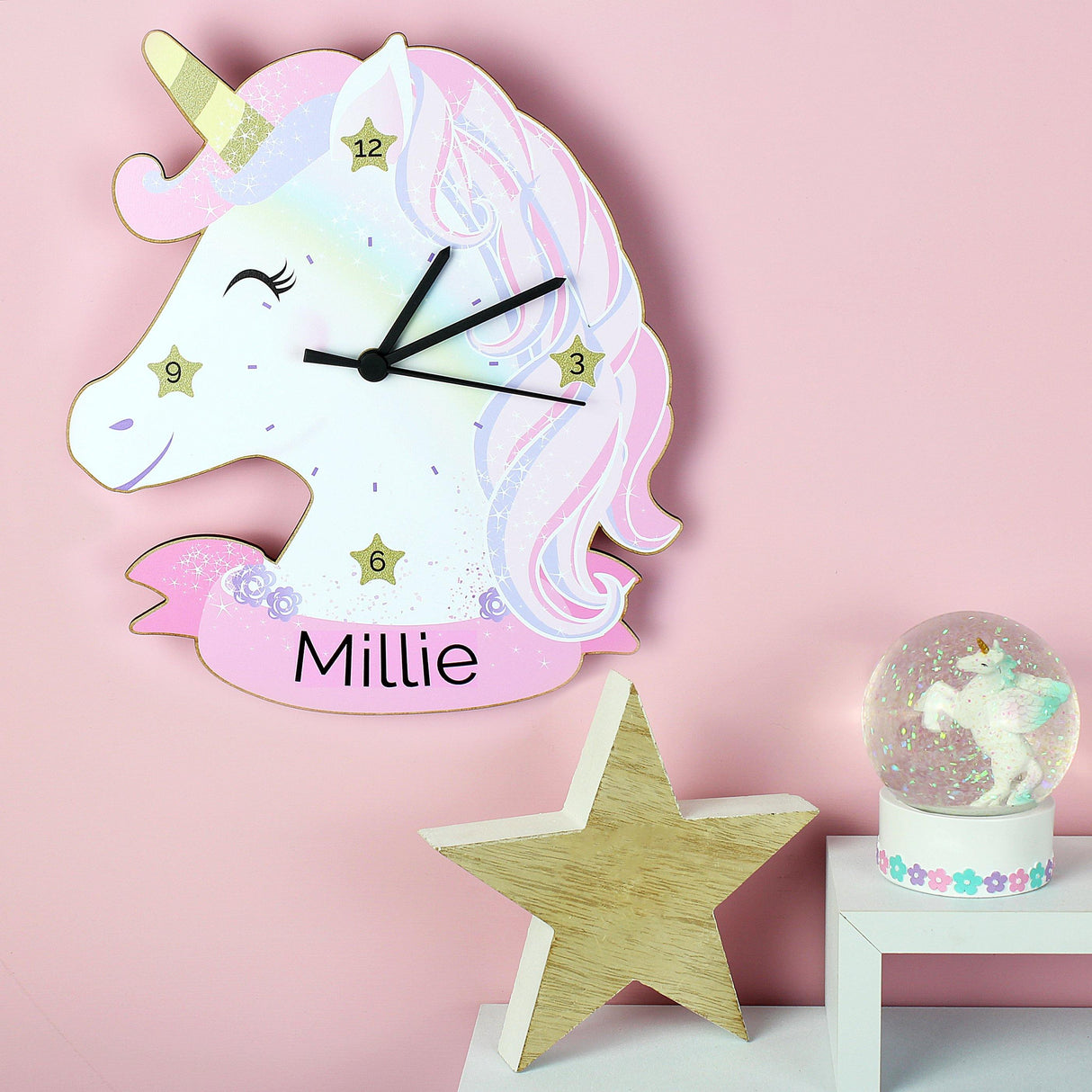 Personalised Unicorn Wall Clock on a wall in a room